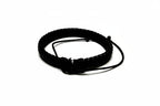 Black braided bracelet on a white background